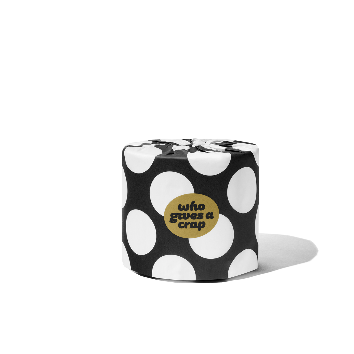 Singular toilet paper roll in a polka dot wrapper