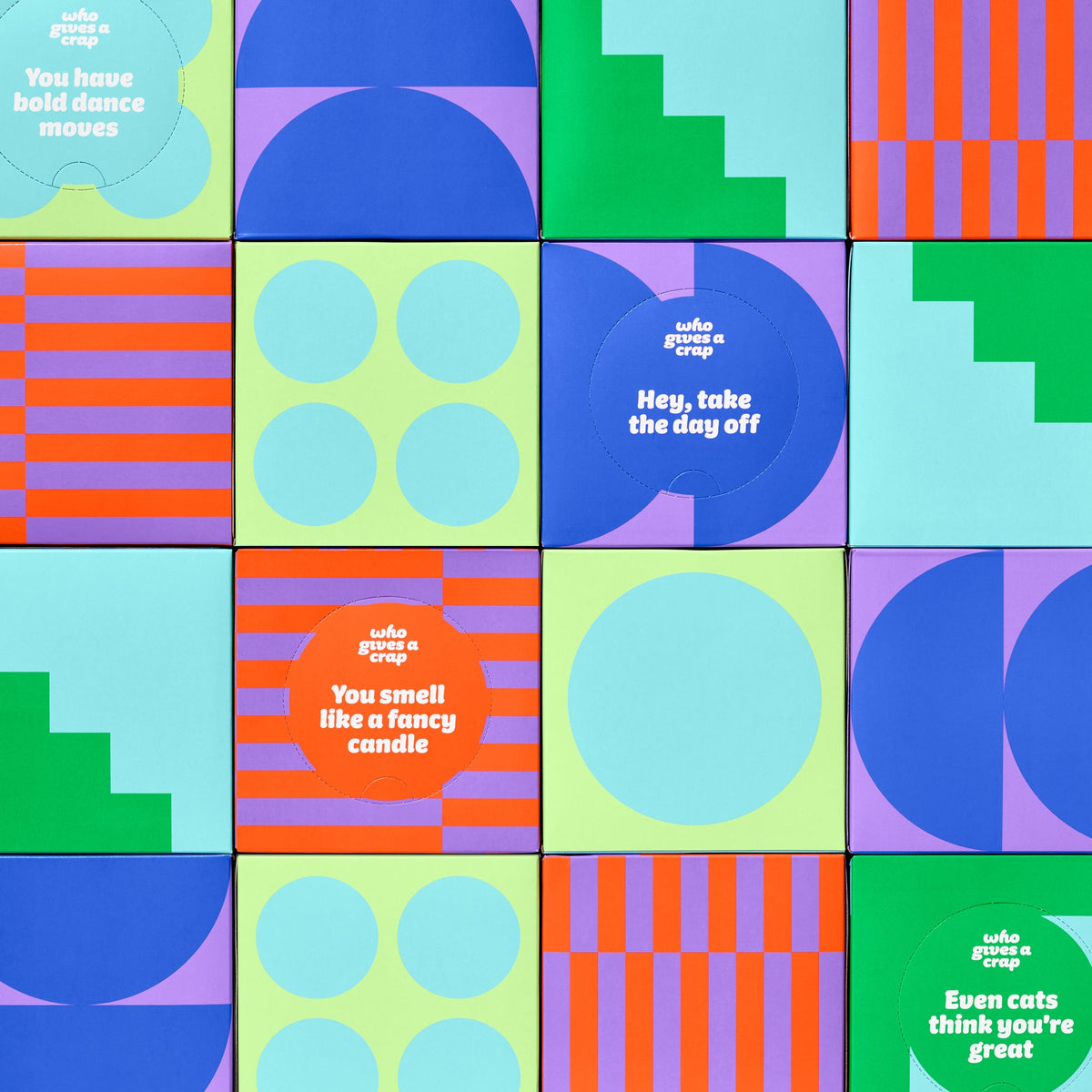 Stacked wall of colourful Who Gives a Crap tissue boxes