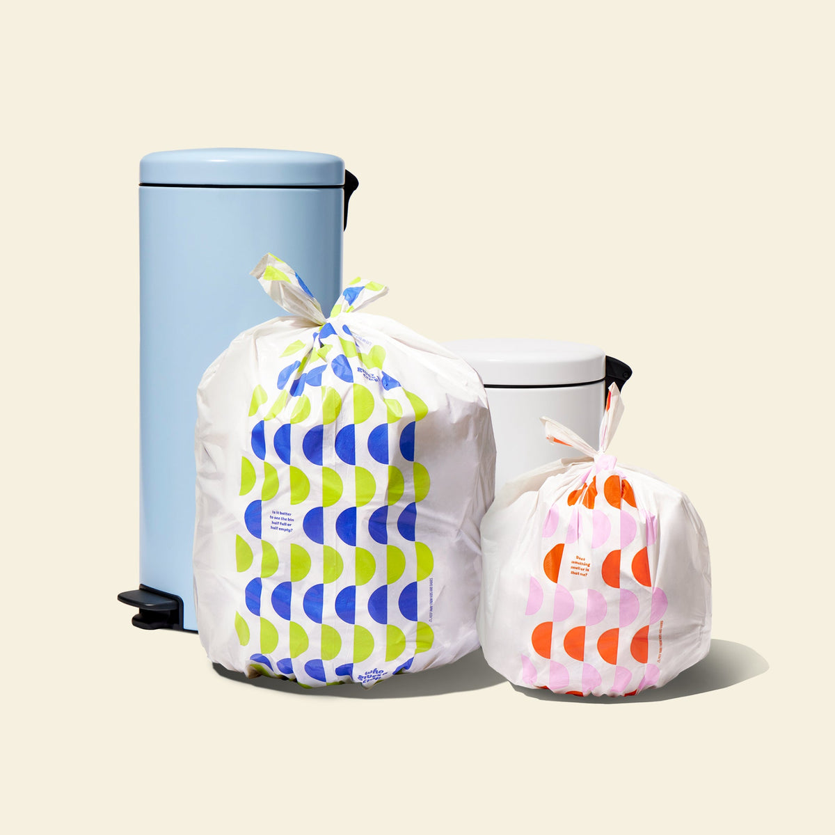 Who Gives a Crap large and small recycled trash bags sitting next to bins