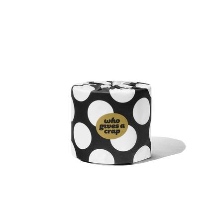 Singular toilet paper roll in a polka dot wrapper